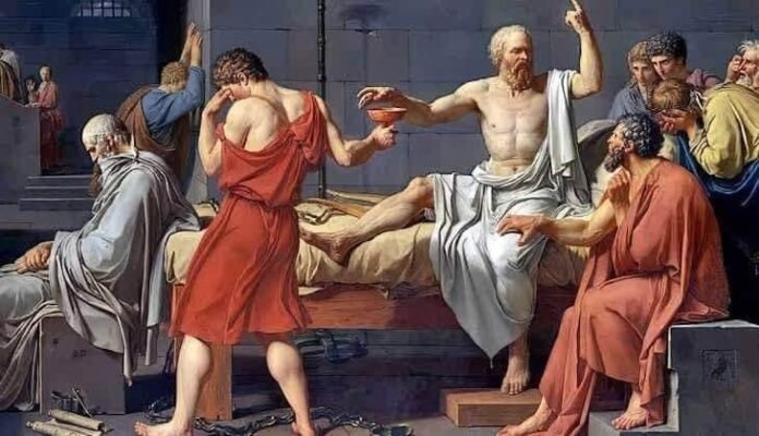 Why was Socrates given the cup of poison Why was Socrates given the cup of poison